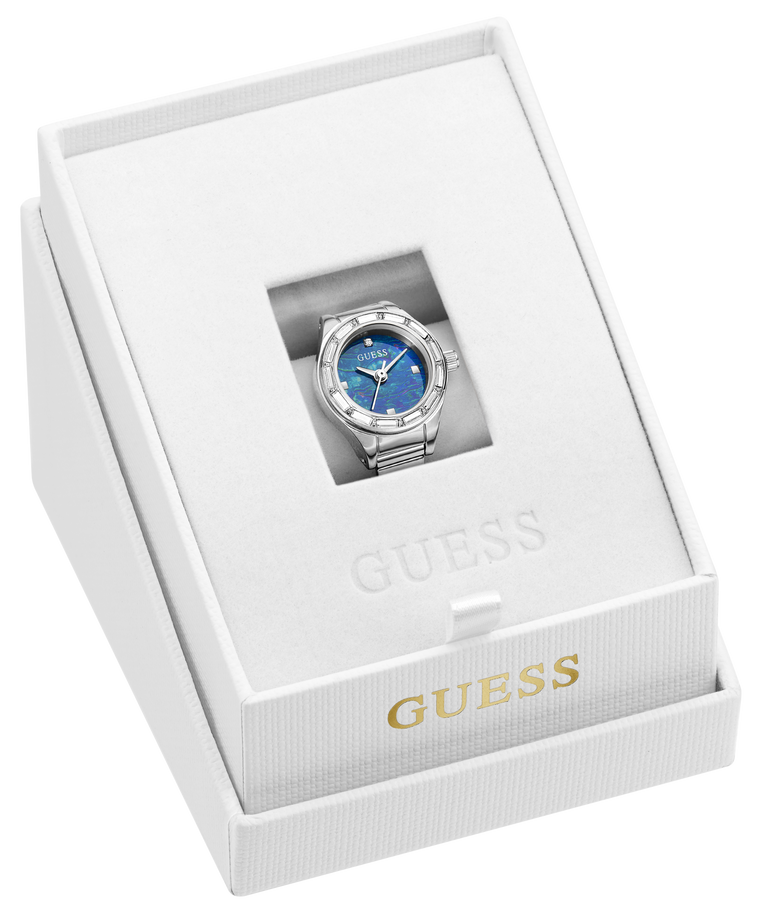 A Guess wristwatch ring with a blue dial and silver-tone case and bracelet, presented inside an open white Guess gift box with gold branding.