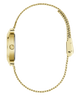 Gold-tone watch shown from the side profile, featuring a slim rectangular case and a matching gold-tone chain strap on a plain white background.