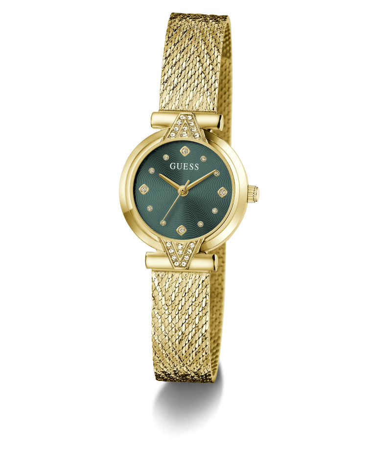 A gold-tone Guess wristwatch with a textured mesh band, a round green dial, and crystal hour markers, shown on a clean white background.