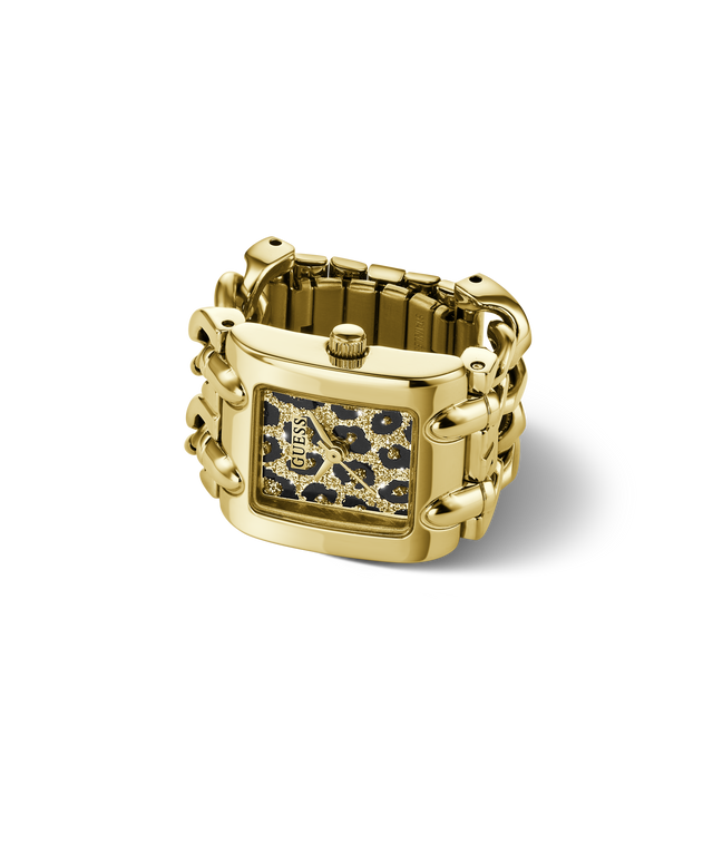 A gold-tone rectangular watch ring with a patterned dial featuring black, gold, and white spots, set against a clean white background.