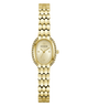 Gold-tone Guess watch with an oval face, crystal-accented bezel, and matching honeycomb-link bracelet on a white background.