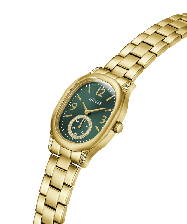 Gold-tone Guess women's watch with an oval green dial, gold-tone metal bracelet, and crystal side accents, shown on a plain white background. lifestyle