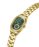 Gold-tone Guess women's watch with an oval green dial, gold-tone metal bracelet, and crystal side accents, shown on a plain white background. lifestyle