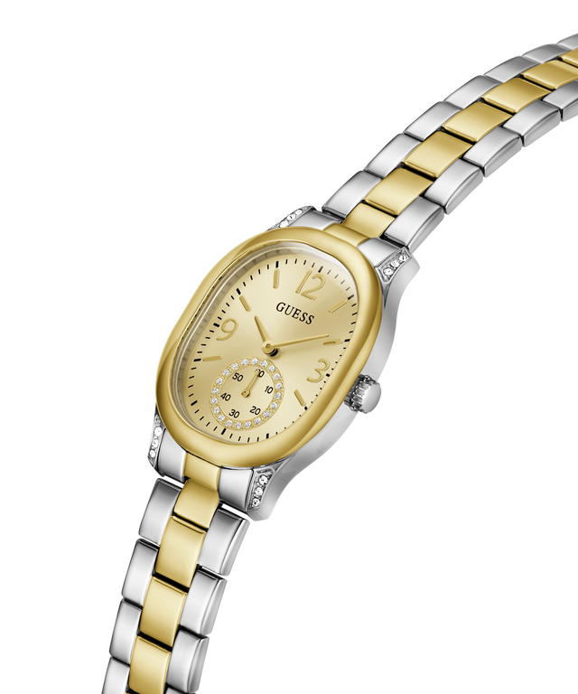 A Guess women's two-tone watch with a gold and silver stainless steel link bracelet, a gold oval case, and a gold dial with crystal accents. lifestyle