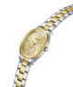 A Guess women's two-tone watch with a gold and silver stainless steel link bracelet, a gold oval case, and a gold dial with crystal accents. lifestyle