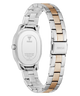 A GUESS women's stainless steel watch with a two-tone link band, shown from the back. The band features alternating silver and rose gold links, and the back of the case is visible with the GUESS logo and 'SSC203' printed on the clasp.