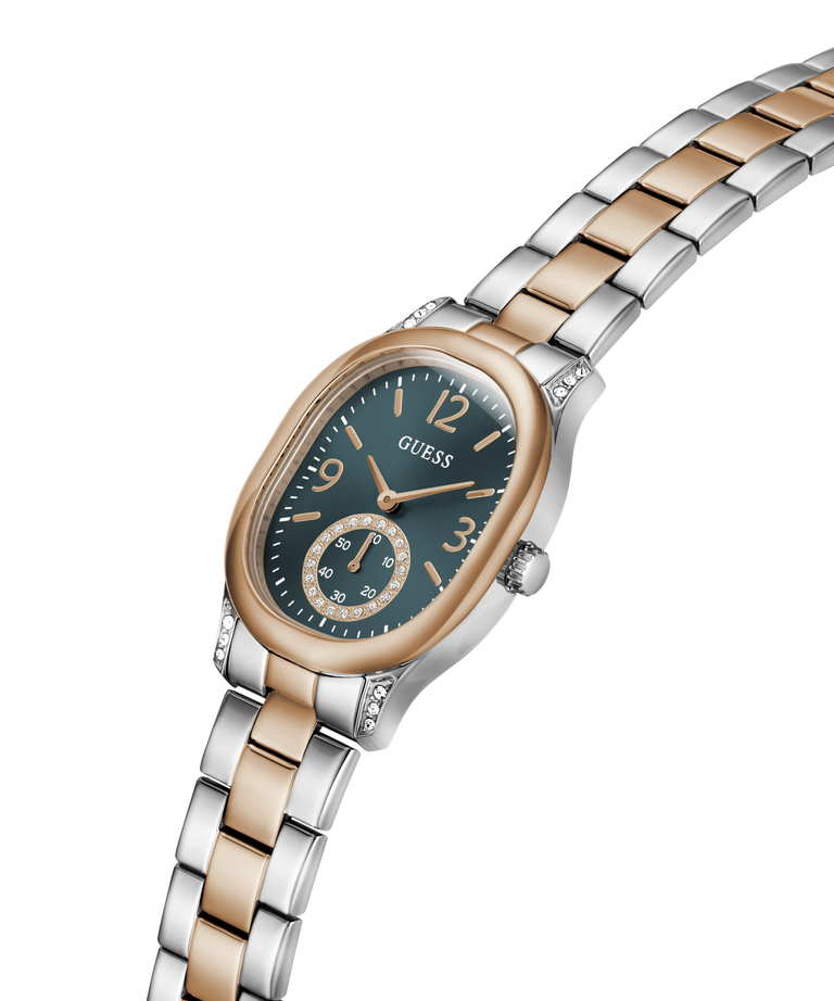 A Guess women's two-tone metal watch with a dark green dial, featuring a silver and rose gold link bracelet and a matching rose gold case, shown on a plain white background. lifestyle