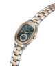 A Guess women's two-tone metal watch with a dark green dial, featuring a silver and rose gold link bracelet and a matching rose gold case, shown on a plain white background. lifestyle