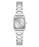 A silver stainless steel wrist watch with a rectangular bezel set with small clear crystals, a matching silver dial with GUESS branding, and a multi-link bracelet, shown against a plain white background.