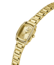 A silver-tone stainless steel women's watch by Guess, featuring a rectangular bezel encrusted with clear crystals, a silver dial with a date window, and a matching steel link bracelet, shown on a plain white background. lifestyle