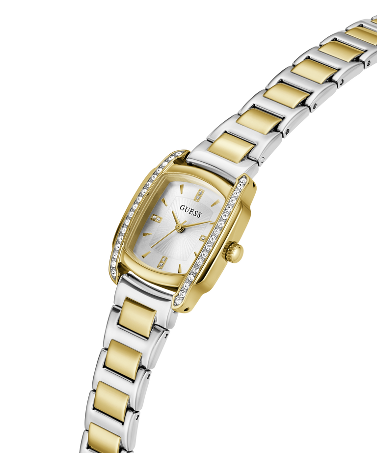 A two-tone Guess watch with a silver and gold-tone metal link bracelet, a silver dial, and a bezel accented with small clear crystals, shown on a plain white background. lifestyle