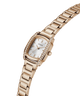 A silver-tone stainless steel women's watch by Guess, featuring a rectangular bezel encrusted with clear crystals, a silver dial with a date window, and a matching steel link bracelet, shown on a plain white background. lifestyle