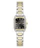 A GUESS women's two-tone watch with a silver and gold-tone metal link bracelet, a bezel set with small clear crystals, and a black dial with gold-tone hands and hour markers.