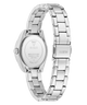 Silver stainless steel women's watch shown from the back, featuring a matching metal link bracelet, a round case, and a visible GUESS logo on both the clasp and the watch case back.