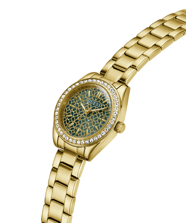 Gold-tone Guess watch with a green marbled dial, crystal-encrusted bezel, and matching gold-tone metal link bracelet on a white background. lifestyle