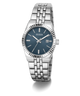 A Guess women's stainless steel watch with a blue dial, silver-tone fluted bezel, and matching steel link bracelet, shown on a clean white background.