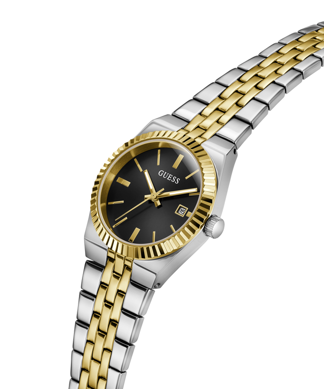 A two-tone Guess women's watch with a silver and gold stainless steel link bracelet, a gold fluted bezel, and a black dial with gold hands and indices. lifestyle