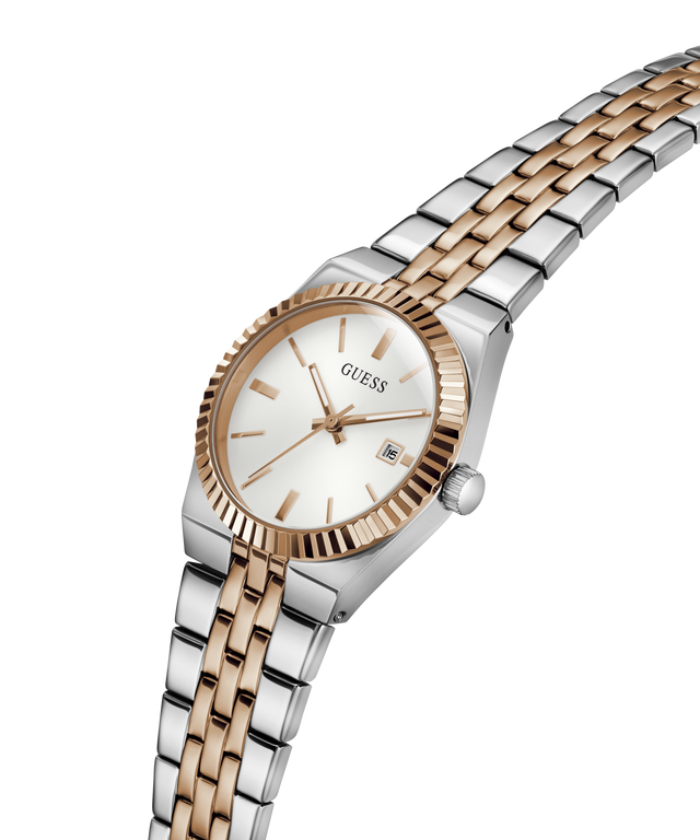 A GUESS women's watch featuring a two-tone silver and rose gold metal bracelet, a fluted rose gold bezel, and a white dial with a date window. lifestyle