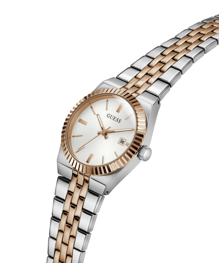 A GUESS women's watch featuring a two-tone silver and rose gold metal bracelet, a fluted rose gold bezel, and a white dial with a date window. lifestyle