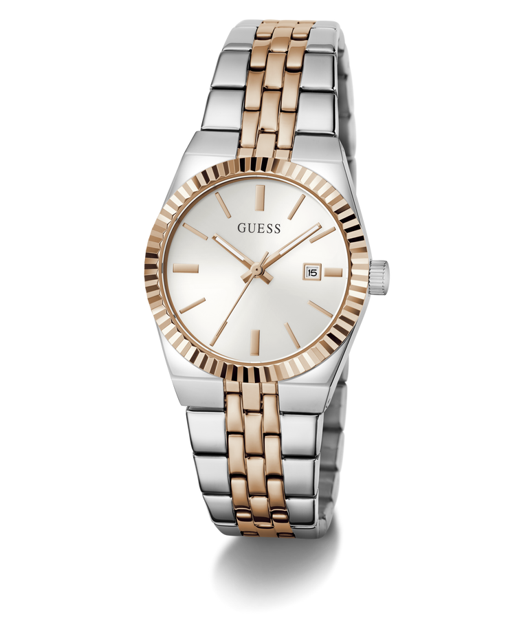 A GUESS women's two-tone stainless steel and rose gold watch with a white dial, fluted bezel, and date window, shown on a clean white background.