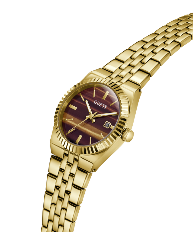 Gold-tone GUESS women's watch with a maroon sunburst dial and a matching gold-tone metal link bracelet, shown on a plain white background. lifestyle