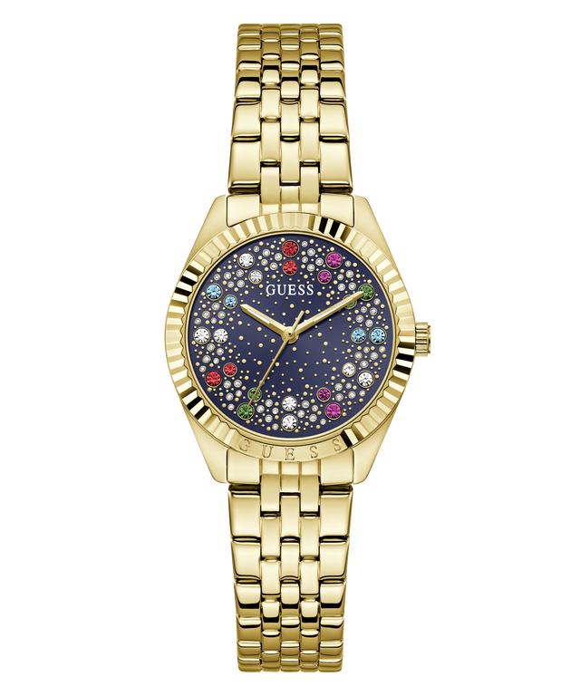 A gold-tone stainless steel wrist watch by Guess with a dark blue dial decorated with colorful rhinestones and white star details, set against a plain white background.