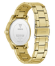 Gold-tone stainless steel watch with a metal link bracelet, shown from the back on a clean white background. The back case features a silver circular plate with 'GUESS' branding and specifications, and the clasp is marked 'GS108U'.