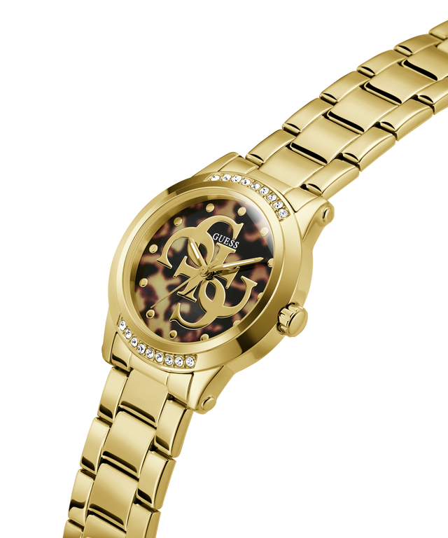 Gold-tone Guess watch with a metal link bracelet, crystal-studded bezel, and a dark tortoiseshell dial featuring the Guess logo. lifestyle
