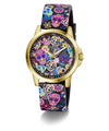 A GUESS women's watch featuring a gold-tone case and a black strap decorated with a colorful Day of the Dead sugar skull and floral pattern, set against a plain white background.