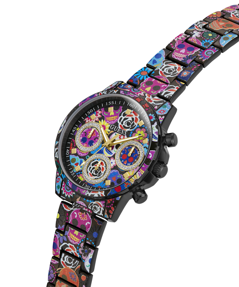 A GUESS wristwatch with a black case and a colorful Day of the Dead sugar skull patterned metal bracelet, shown on a plain white background. lifestyle