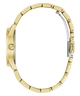 A close-up side view of a gold-tone watch with a matching metal link bracelet, showing the side case, crown, and clasp on a plain white background.