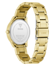 Gold-tone stainless steel wrist watch shown from the back, featuring a matching metal link bracelet, a round case, and a clear back cover with GUESS branding and model details.