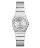 A Guess women's analog watch with a silver-tone stainless steel case and integrated link bracelet, featuring a silver dial with simple hour markers and a crown on the right side.