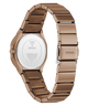 Coffee stainless steel women's watch shown from the back, featuring a metallic link bracelet and a circular case backplate with GUESS branding.
