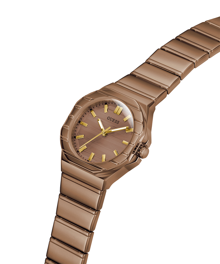 A Guess women's watch featuring a metallic rose gold-tone case and link bracelet, with a matching rose gold dial and gold-tone hour markers and hands, shown on a plain white background. lifestyle