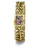 A gold-tone GUESS watch with a thick chain-link bracelet and a rectangular face featuring a navy blue background with pink and gold floral details.