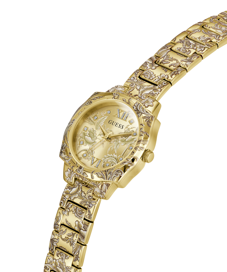 Gold-tone Guess women's watch with an ornate floral patterned metal link bracelet and a matching dial, featuring Roman numeral hour markers. lifestyle