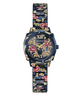 A GUESS women's watch featuring a navy blue case and link bracelet decorated with gold floral patterns and pink rose details, set against a plain white background.