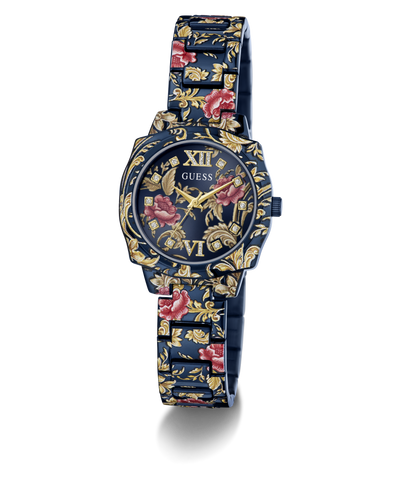 A GUESS women's watch featuring a dark blue metal case and link bracelet decorated with a gold floral pattern and red rose accents, set against a plain white background.