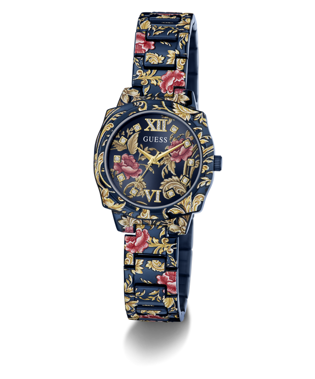 A GUESS women's watch featuring a dark blue metal case and link bracelet decorated with a gold floral pattern and red rose accents, set against a plain white background.
