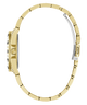 A close-up side view of a gold-tone watch bracelet with a two-tone silver clasp, set against a plain white background.