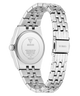 Silver stainless steel wristwatch shown from the back, featuring a matching metal link bracelet and a clear back cover with GUESS branding and technical specifications.