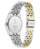 The back view of a GUESS women's analog watch with a two-tone stainless steel and yellow gold link bracelet, on a solid white background.