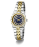 A Guess women's two-tone stainless steel and yellow gold watch with a blue dial, crystal-embellished bezel, and date window, shown on a clean white background.