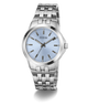 A GUESS men's analog watch featuring a stainless steel link bracelet, a round silver case, and a light blue dial with silver-tone hour markers and hands.