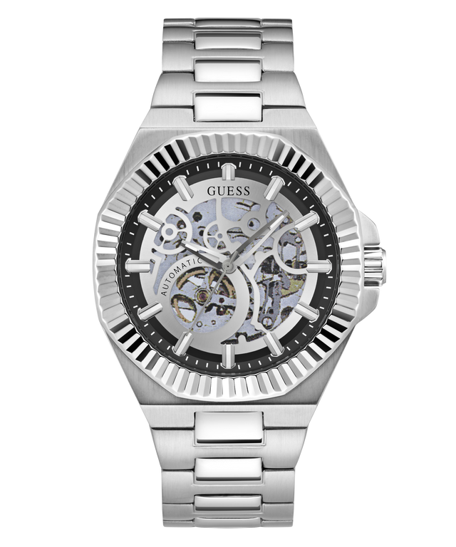 A Guess automatic skeleton watch with a silver stainless steel case and link bracelet, featuring a black dial with a visible mechanical movement through the case.