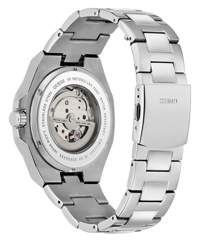 A stainless steel wristwatch shown from the back, featuring a transparent case back that reveals the mechanical movement and a matching stainless steel link bracelet. The brand name 'Guess' is engraved on the clasp.