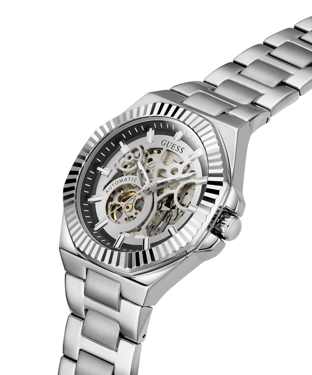 A silver stainless steel wristwatch with a skeleton dial and matching steel link bracelet, shown on a clean white background. lifestyle