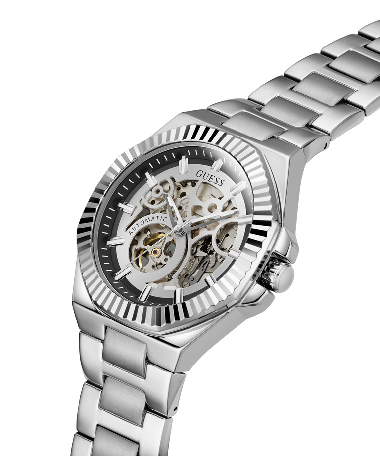A silver stainless steel wristwatch with a skeleton dial and matching steel link bracelet, shown on a clean white background. lifestyle
