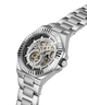 A silver stainless steel wristwatch with a skeleton dial and matching steel link bracelet, shown on a clean white background. lifestyle